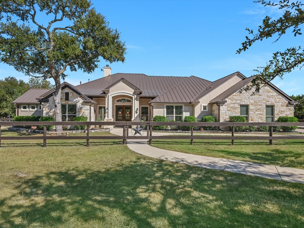 2051 Windmill Run Wimberley, TX 78676 - Photo 1 of 1 a front view of a house with a yard