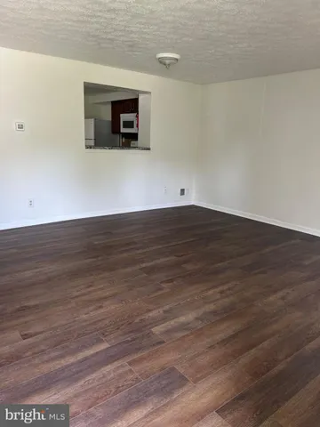 a view of a livingroom with wooden floor