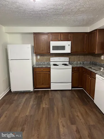 a kitchen with a stove and a microwave