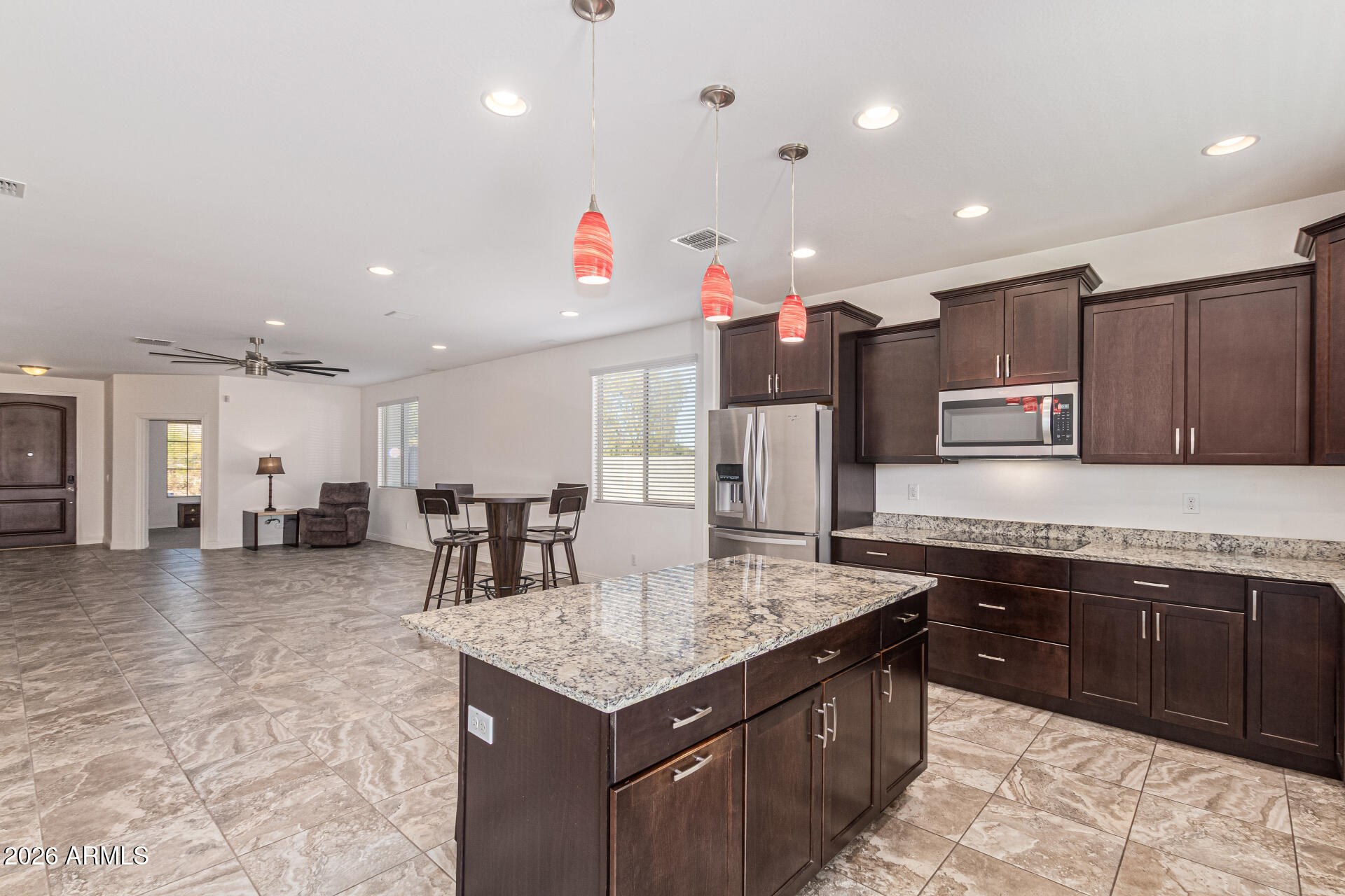 32187 North Royce Road San Tan Valley, AZ 85144 - Photo 11 of 38 a kitchen with stainless steel appliances granite countertop a sink counter space and cabinets