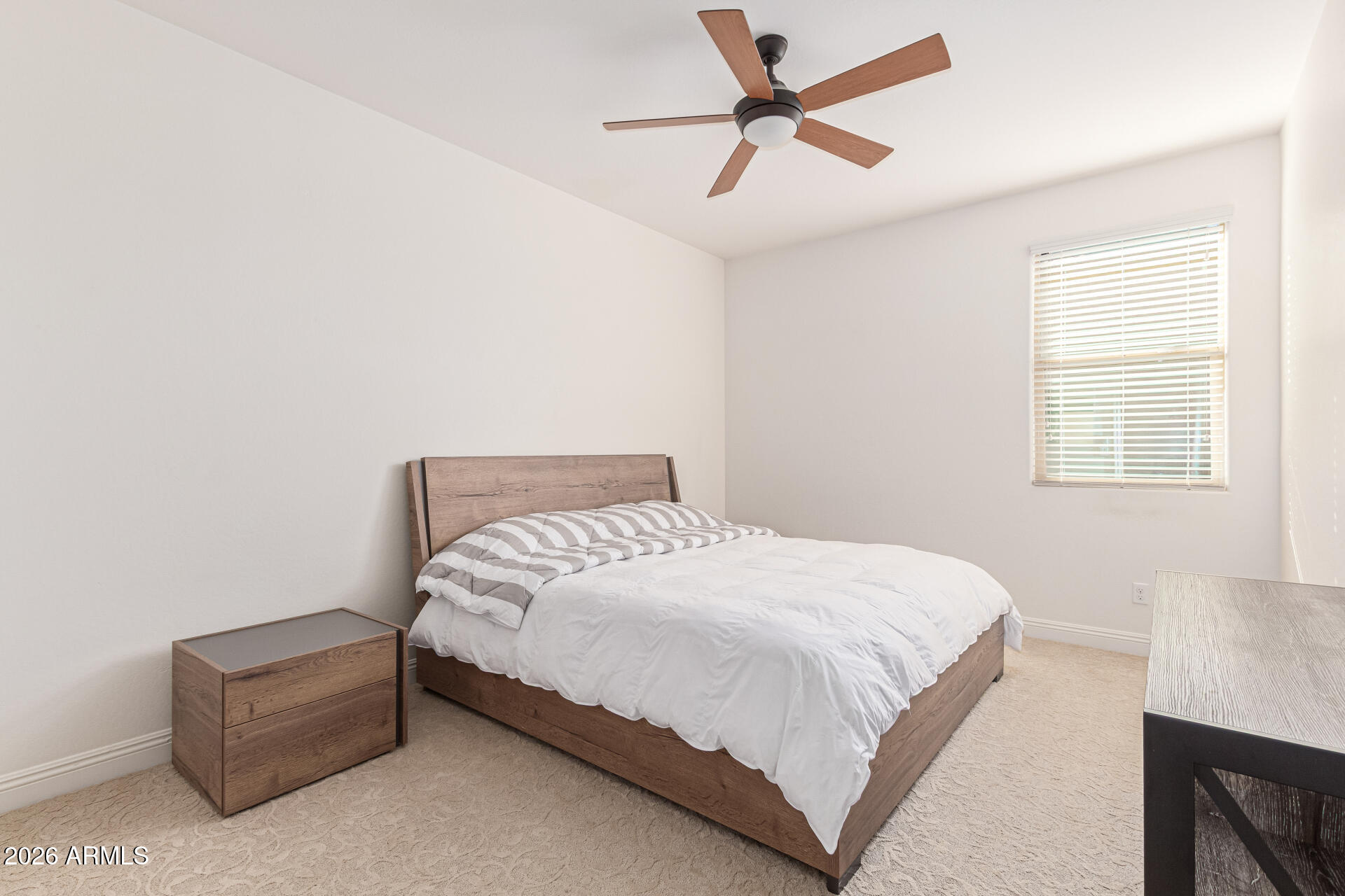 32187 North Royce Road San Tan Valley, AZ 85144 - Photo 20 of 38 a bedroom with a bed rug and window