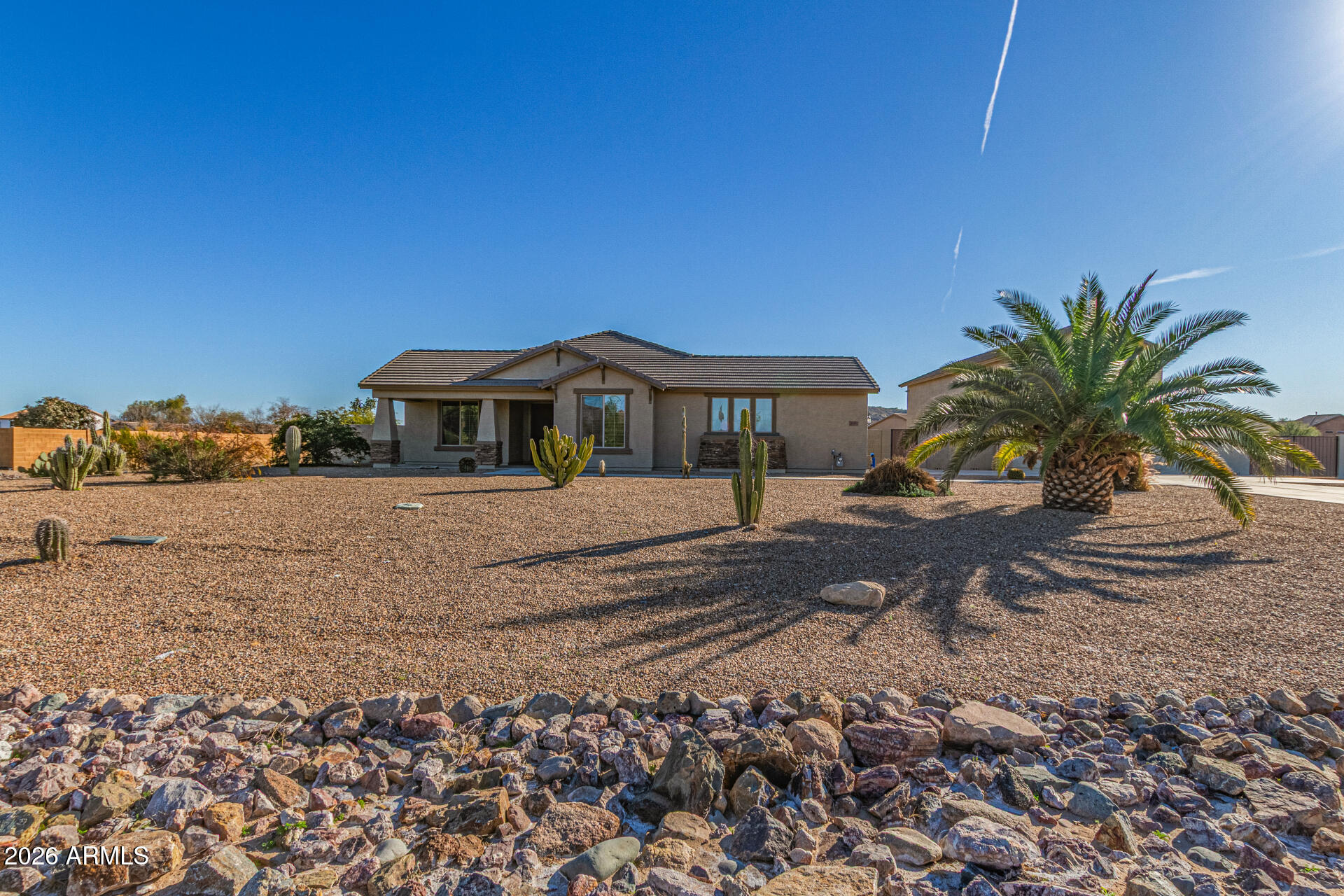 32187 North Royce Road San Tan Valley, AZ 85144 - Photo 2 of 38 a front view of a house with garden