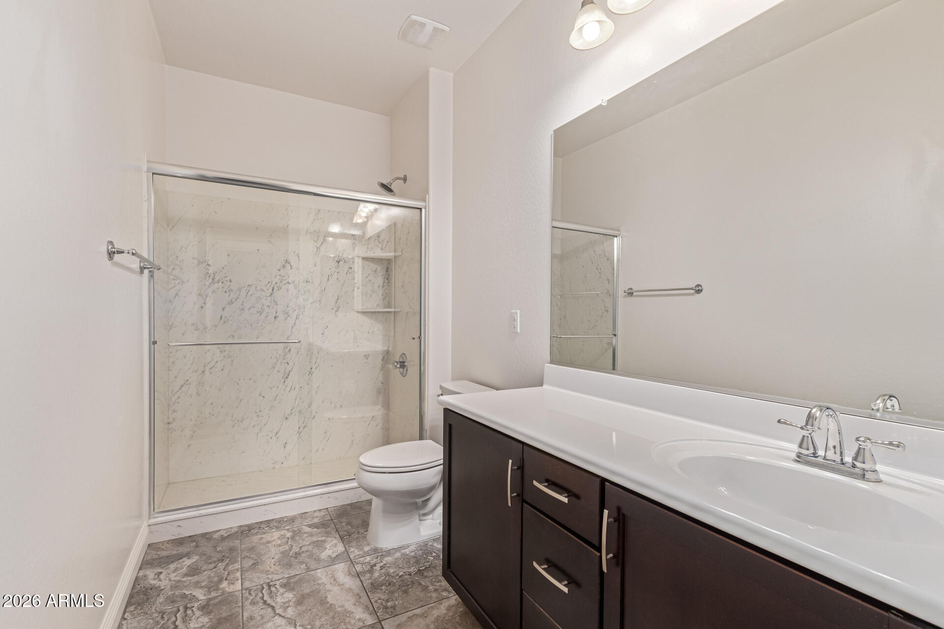 32187 North Royce Road San Tan Valley, AZ 85144 - Photo 21 of 38 a bathroom with a sink a toilet and shower
