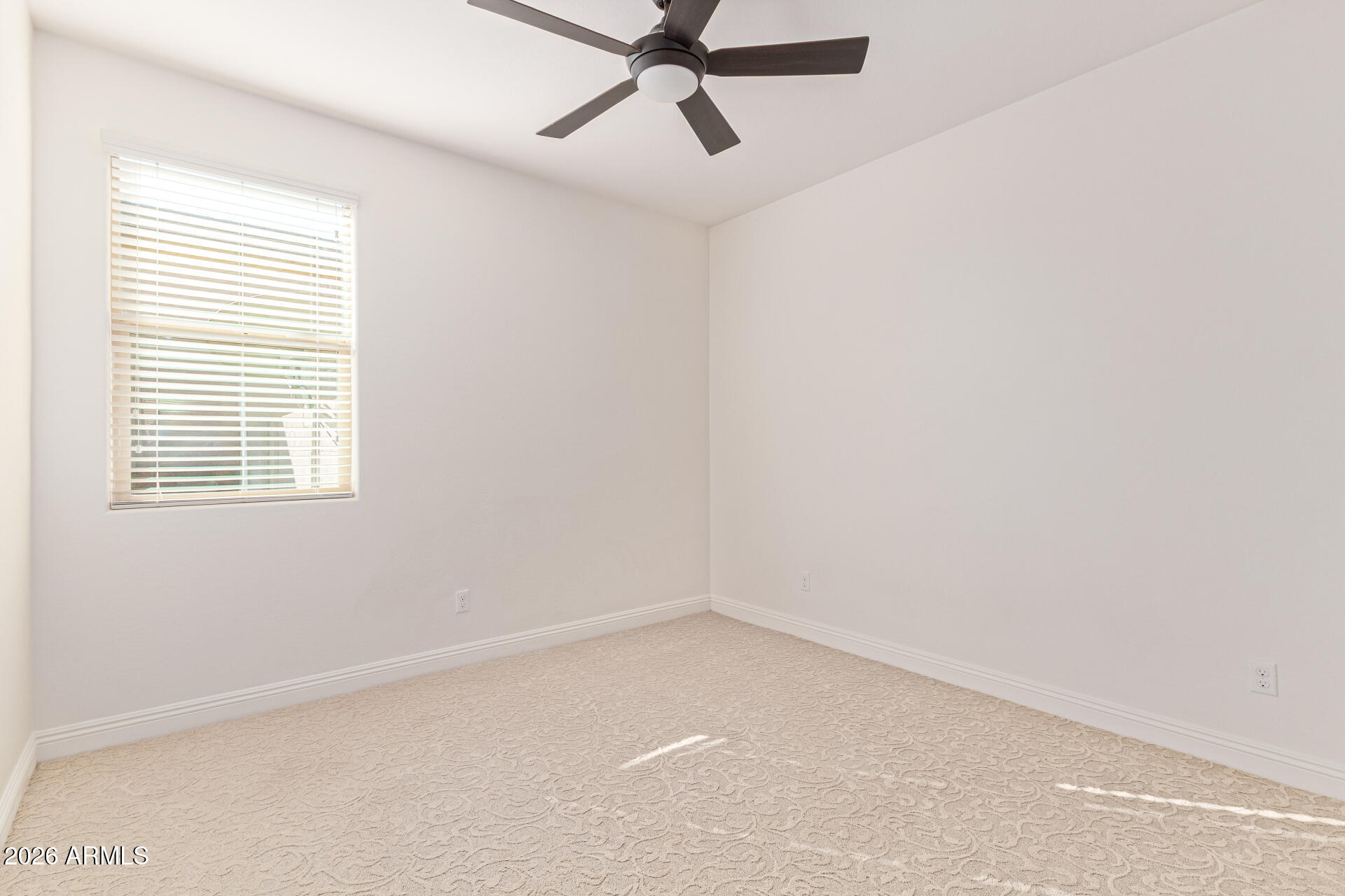 32187 North Royce Road San Tan Valley, AZ 85144 - Photo 23 of 38 an empty room with a window and a fan