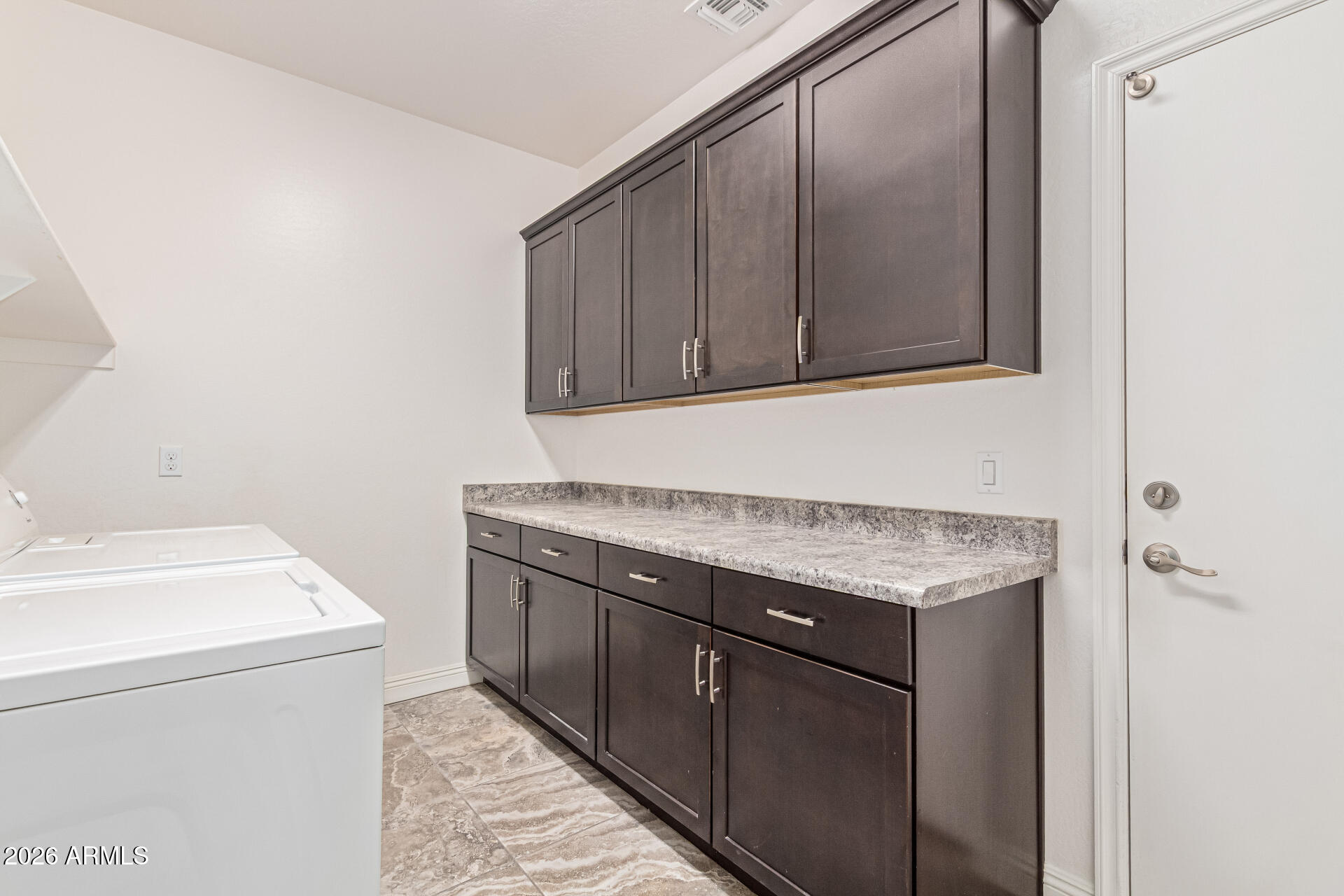 32187 North Royce Road San Tan Valley, AZ 85144 - Photo 25 of 38 a utility room with granite countertop a sink and a vanity