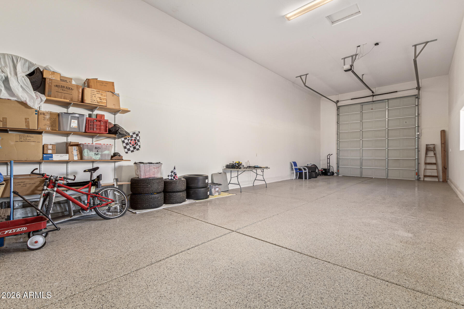 32187 North Royce Road San Tan Valley, AZ 85144 - Photo 29 of 38 a view of a garage with rack and bicycle