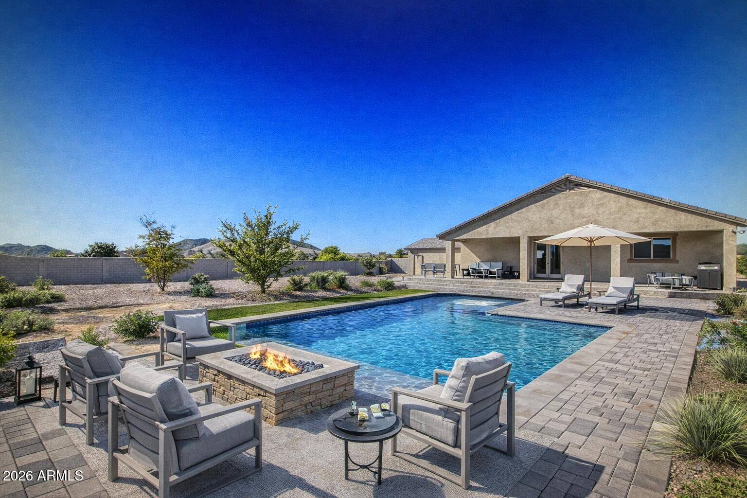 32187 North Royce Road San Tan Valley, AZ 85144 - Photo 32 of 38 a view of a house with swimming pool and sitting area