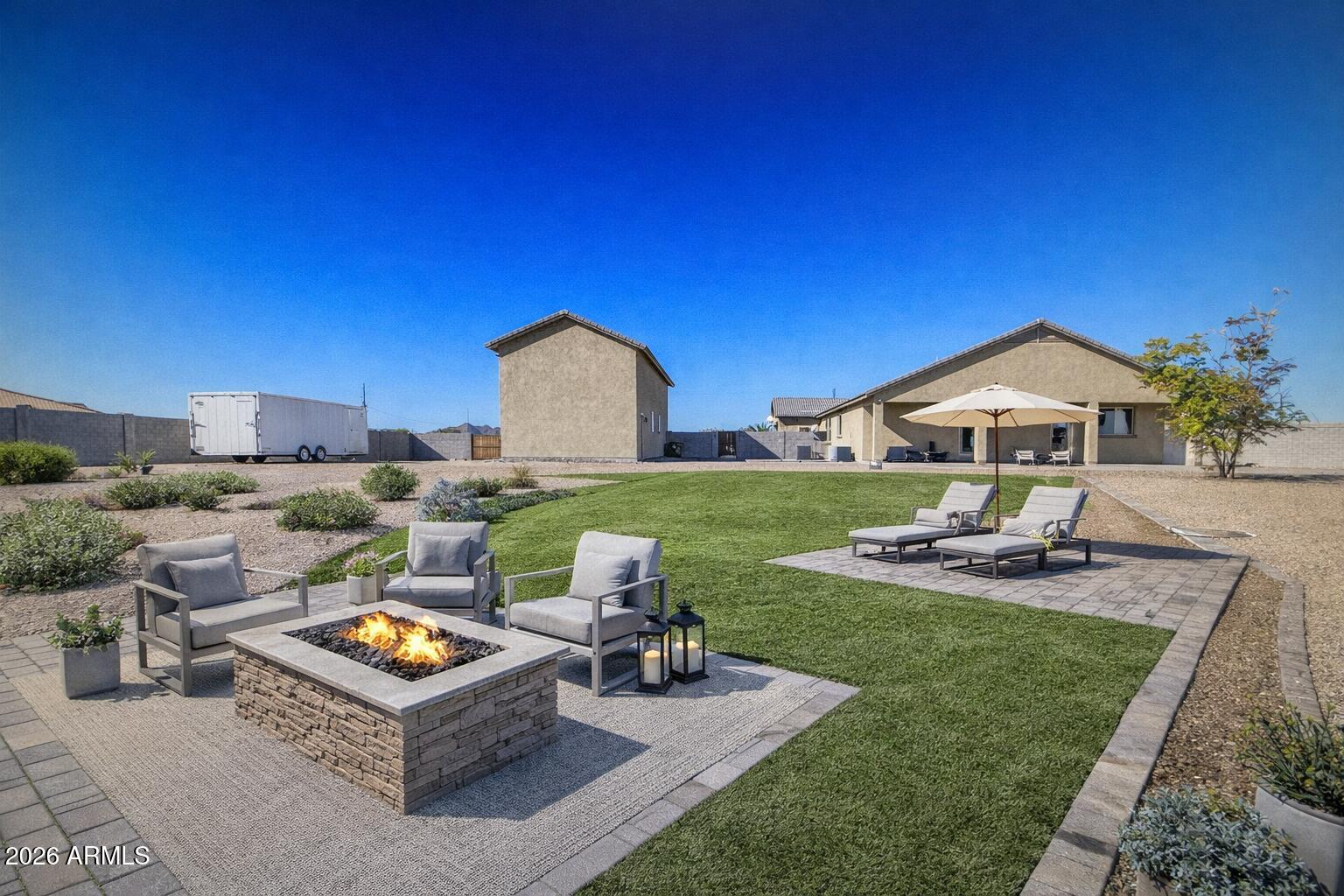 32187 North Royce Road San Tan Valley, AZ 85144 - Photo 34 of 38 a view of a house with backyard sitting area and swimming pool