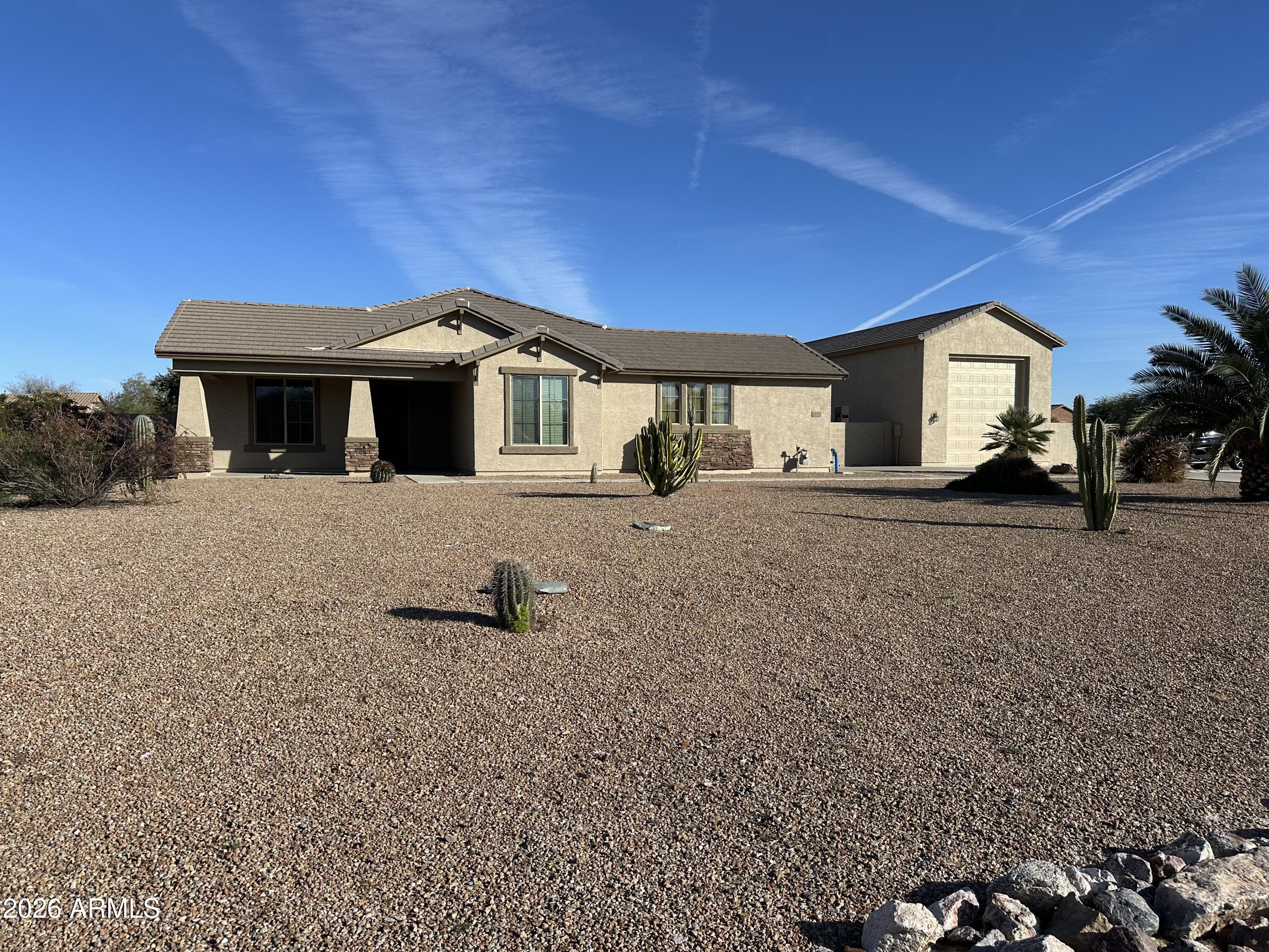32187 North Royce Road San Tan Valley, AZ 85144 - Photo 37 of 38 a front view of a house with a yard