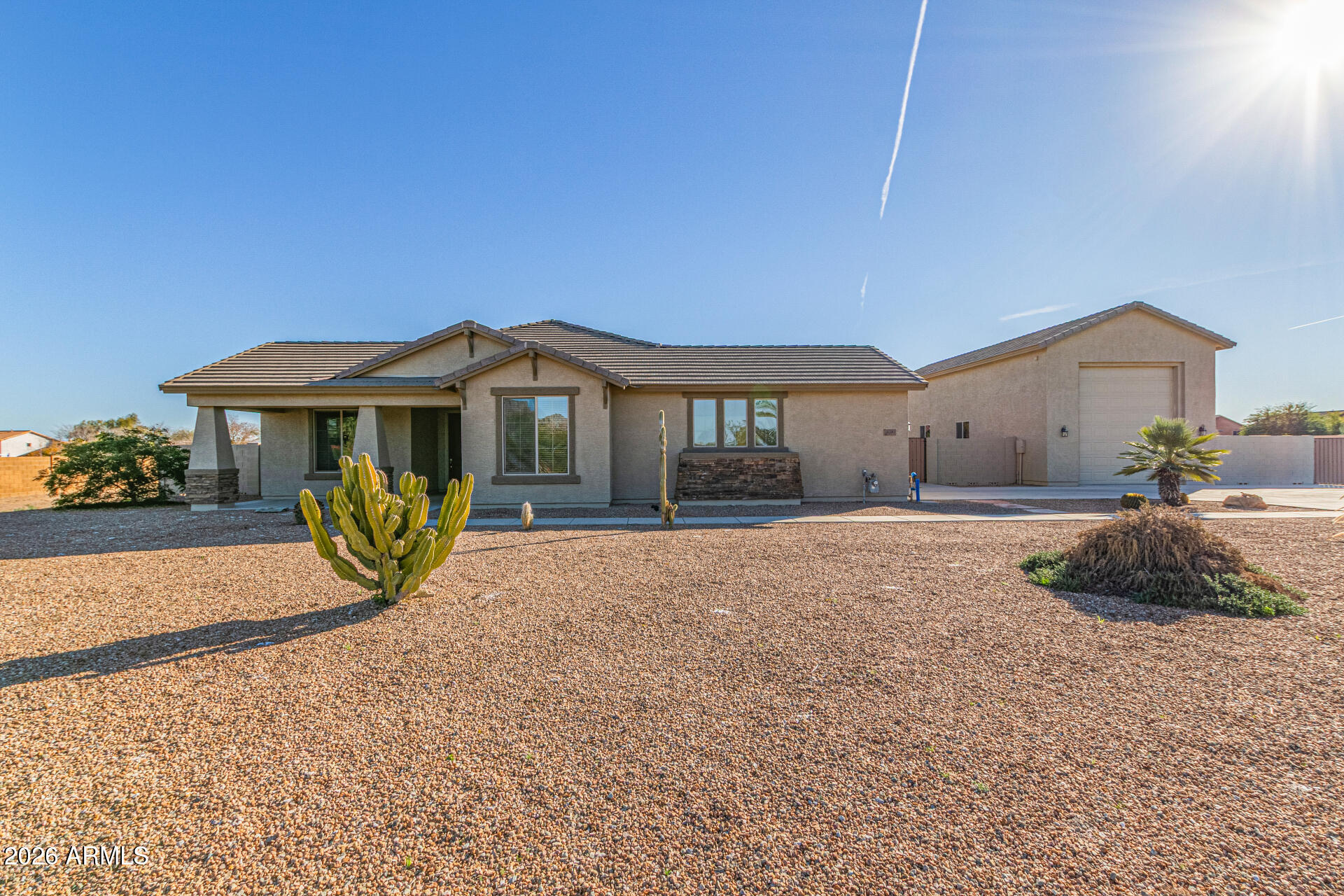 32187 North Royce Road San Tan Valley, AZ 85144 - Photo 4 of 38 a view of a house with a yard and potted plants
