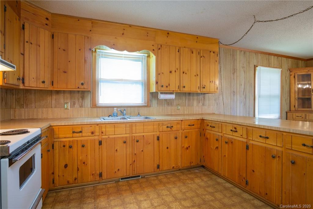 726 Kelly Road York, SC 29745 - Photo 11 of 31 a kitchen with granite countertop cabinets sink and window
