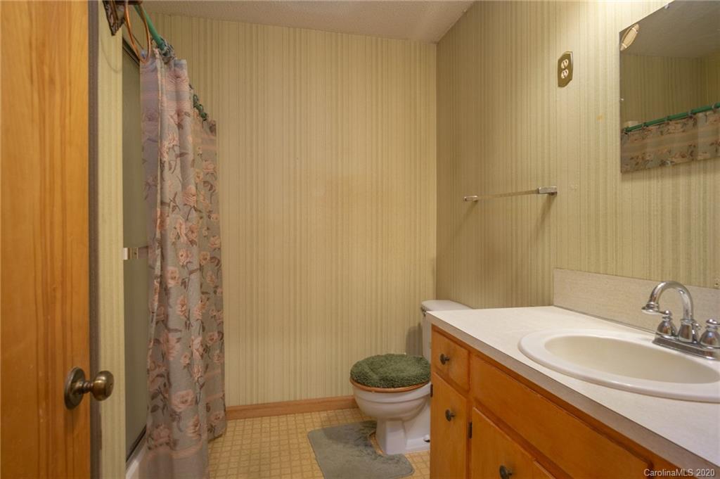 726 Kelly Road York, SC 29745 - Photo 14 of 31 a bathroom with a granite countertop sink toilet and shower