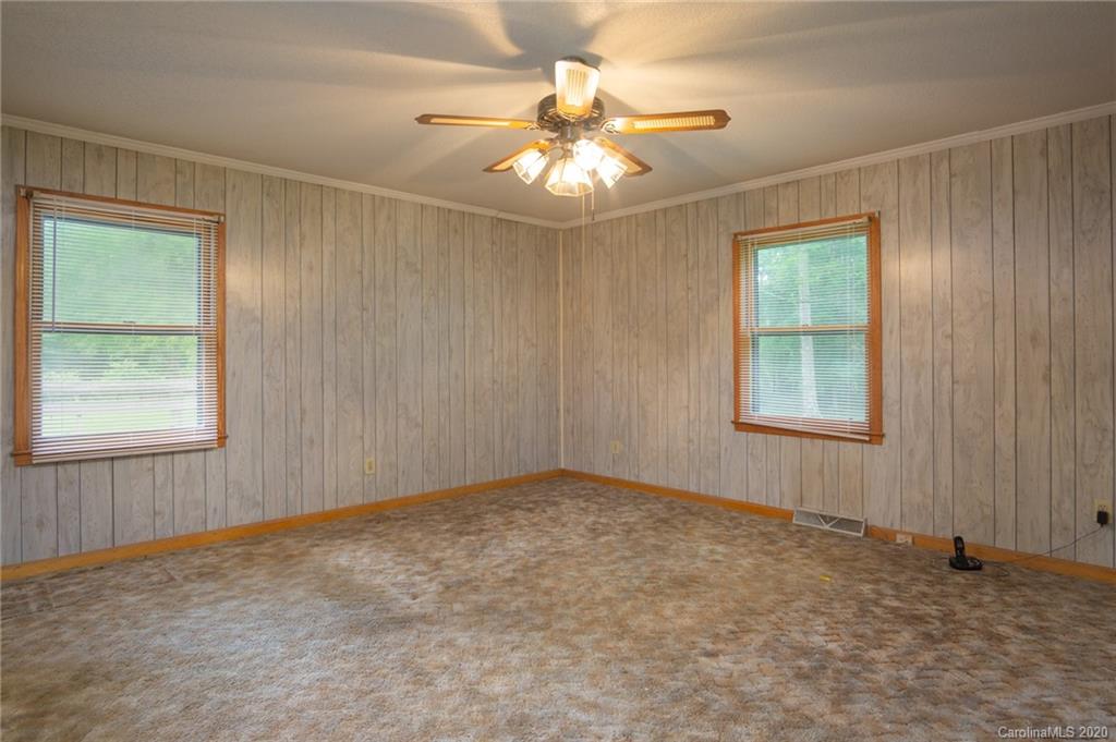 726 Kelly Road York, SC 29745 - Photo 15 of 31 an empty room with windows and chandelier fan