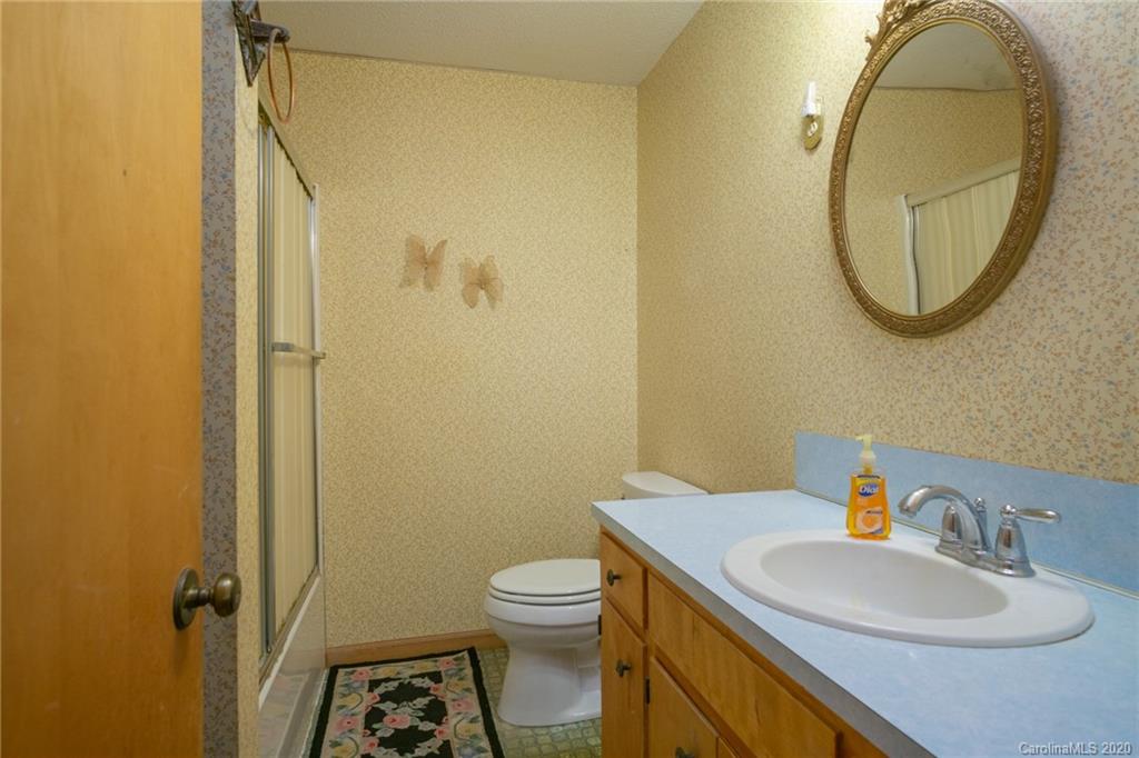 726 Kelly Road York, SC 29745 - Photo 17 of 31 a bathroom with a sink a toilet and a mirror