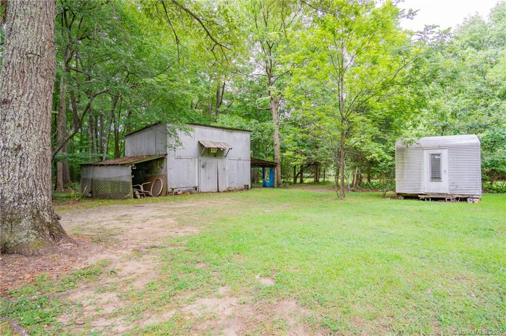 726 Kelly Road York, SC 29745 - Photo 23 of 31 a backyard of a house with a large tree and wooden fence