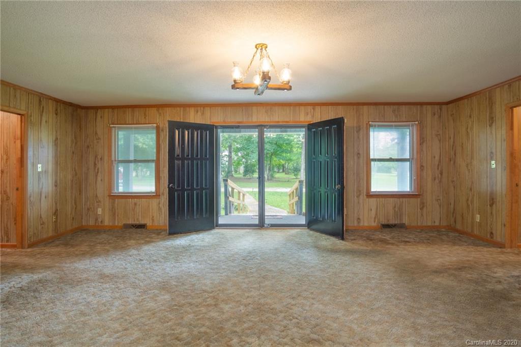 726 Kelly Road York, SC 29745 - Photo 5 of 31 an empty room with windows and view of kitchen