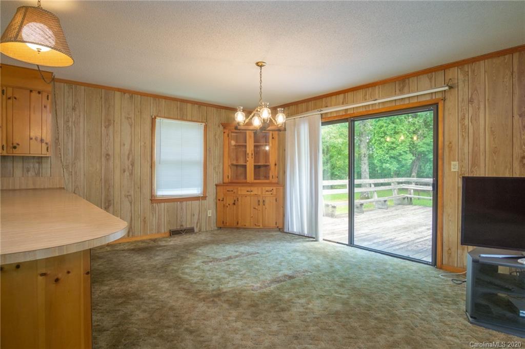 726 Kelly Road York, SC 29745 - Photo 9 of 31 a view of an empty room with a fireplace and a window