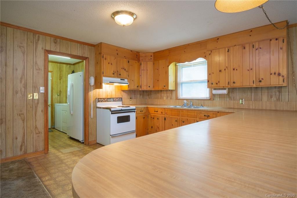 726 Kelly Road York, SC 29745 - Photo 10 of 31 a kitchen with stainless steel appliances granite countertop a stove a sink and a refrigerator