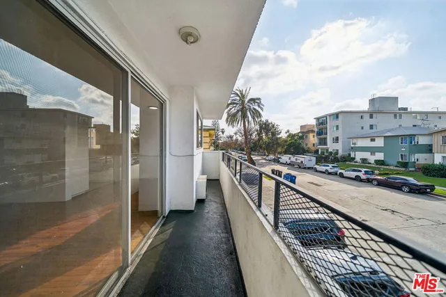 a view of a cars parked in front of a building