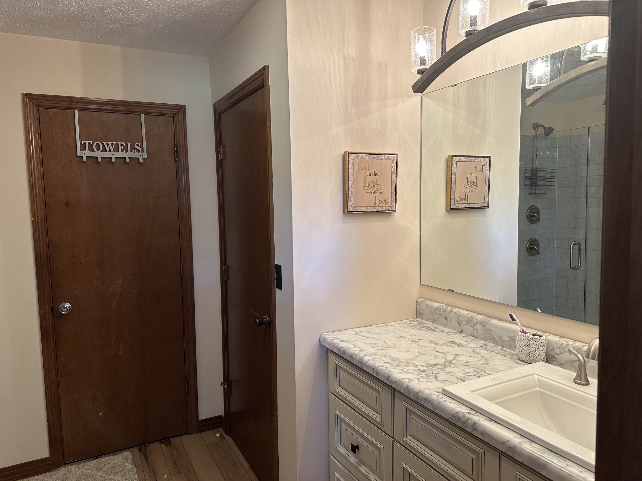 403 Fredonia Road Crossville, TN 38571 - Photo 28 of 50 a bathroom with a granite countertop sink and a mirror