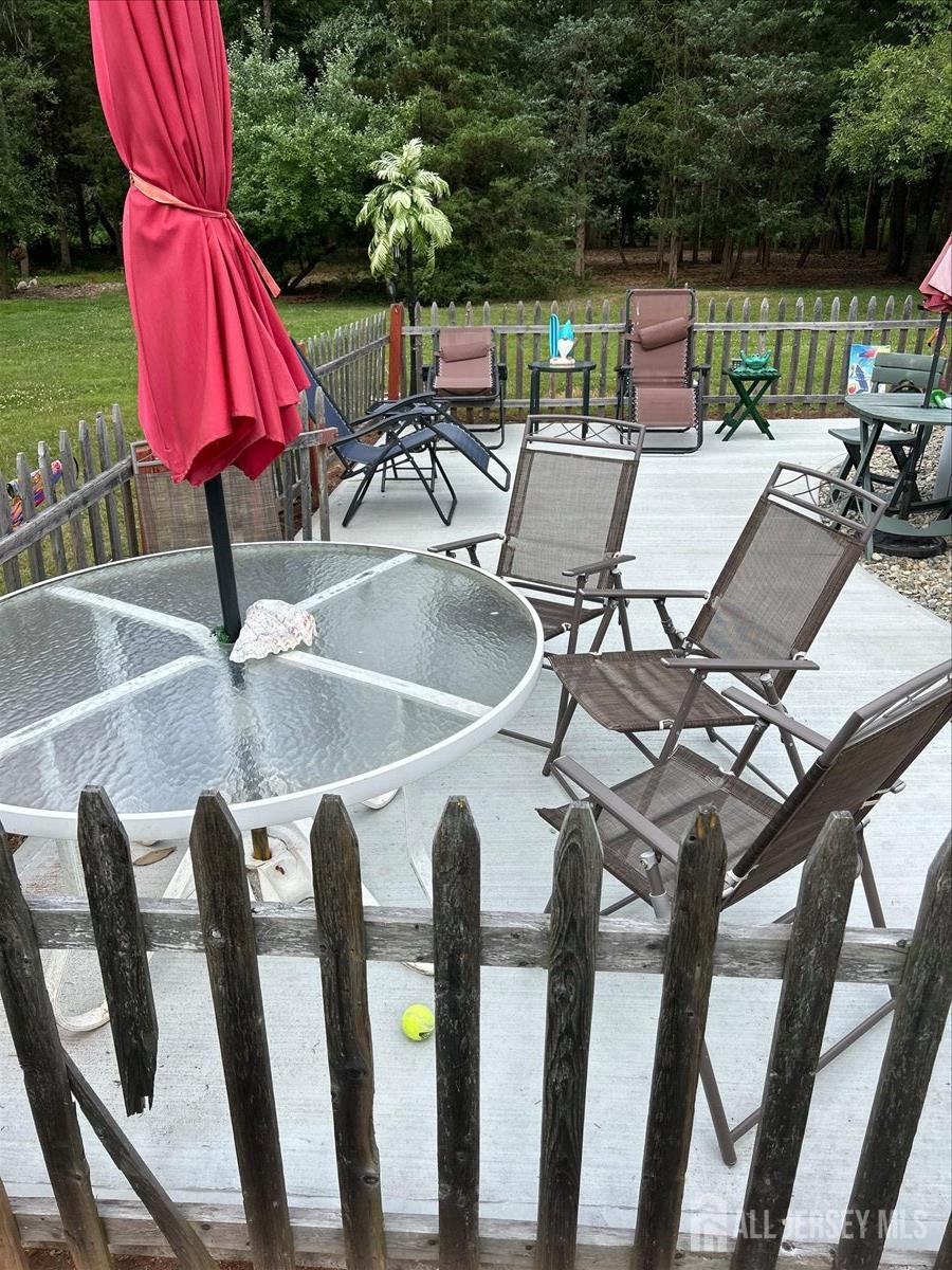 33 Ellison Road Somerset, NJ 08873 - Photo 32 of 38 a view of a chairs and table in patio