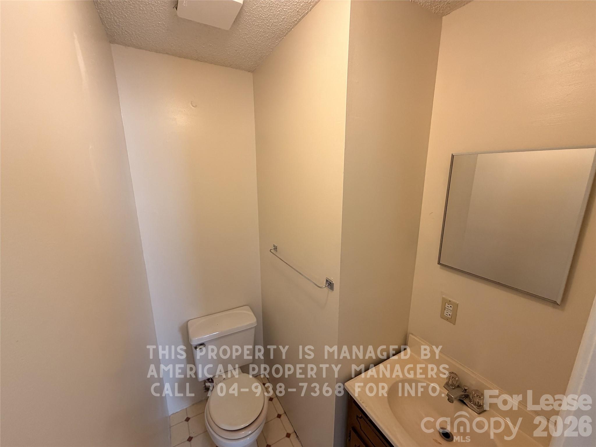 1860 Sells Road Salisbury, NC 28144 - Photo 5 of 9 a bathroom with a granite countertop sink and a mirror
