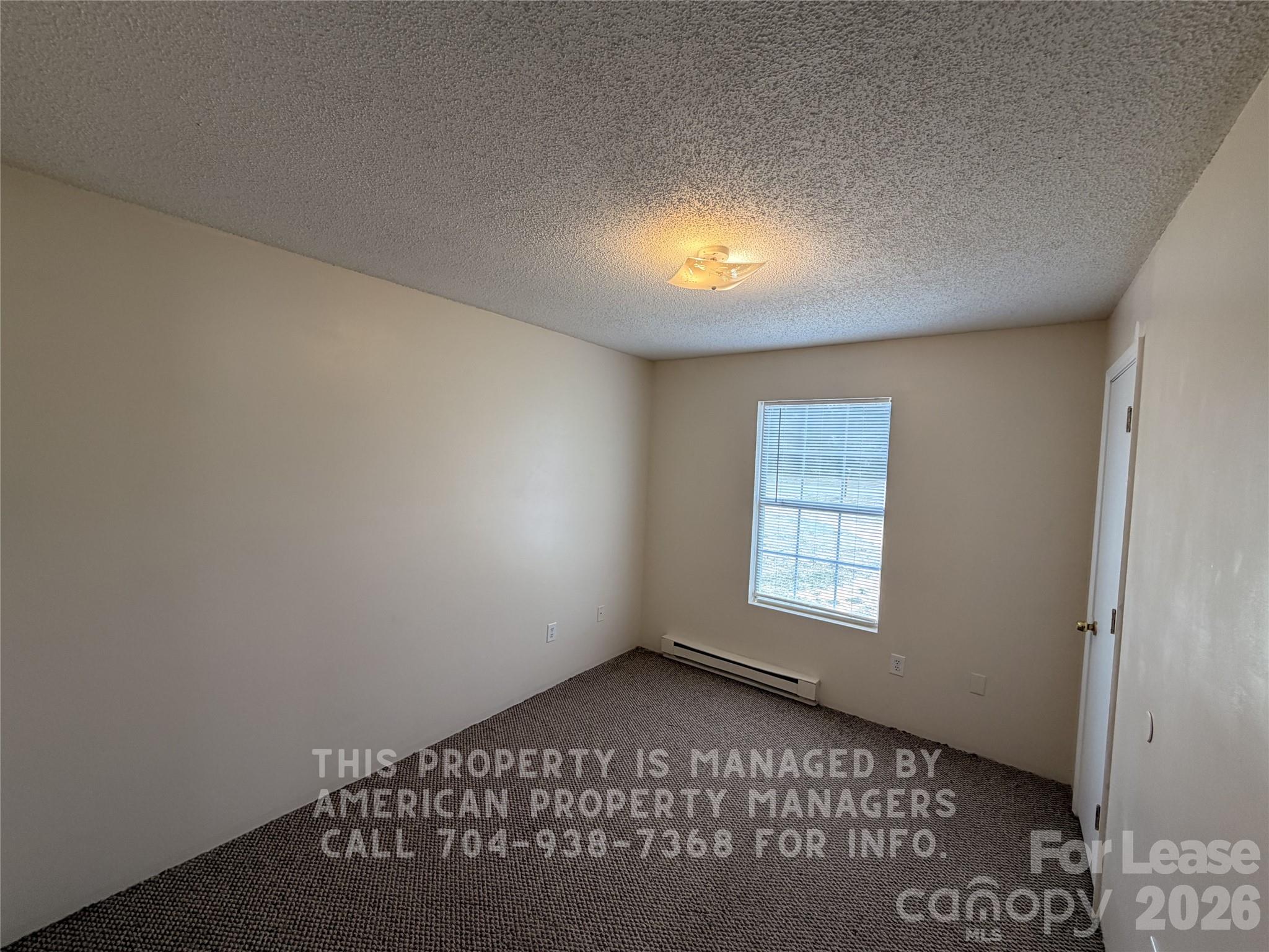 1860 Sells Road Salisbury, NC 28144 - Photo 8 of 9 an empty room with a window