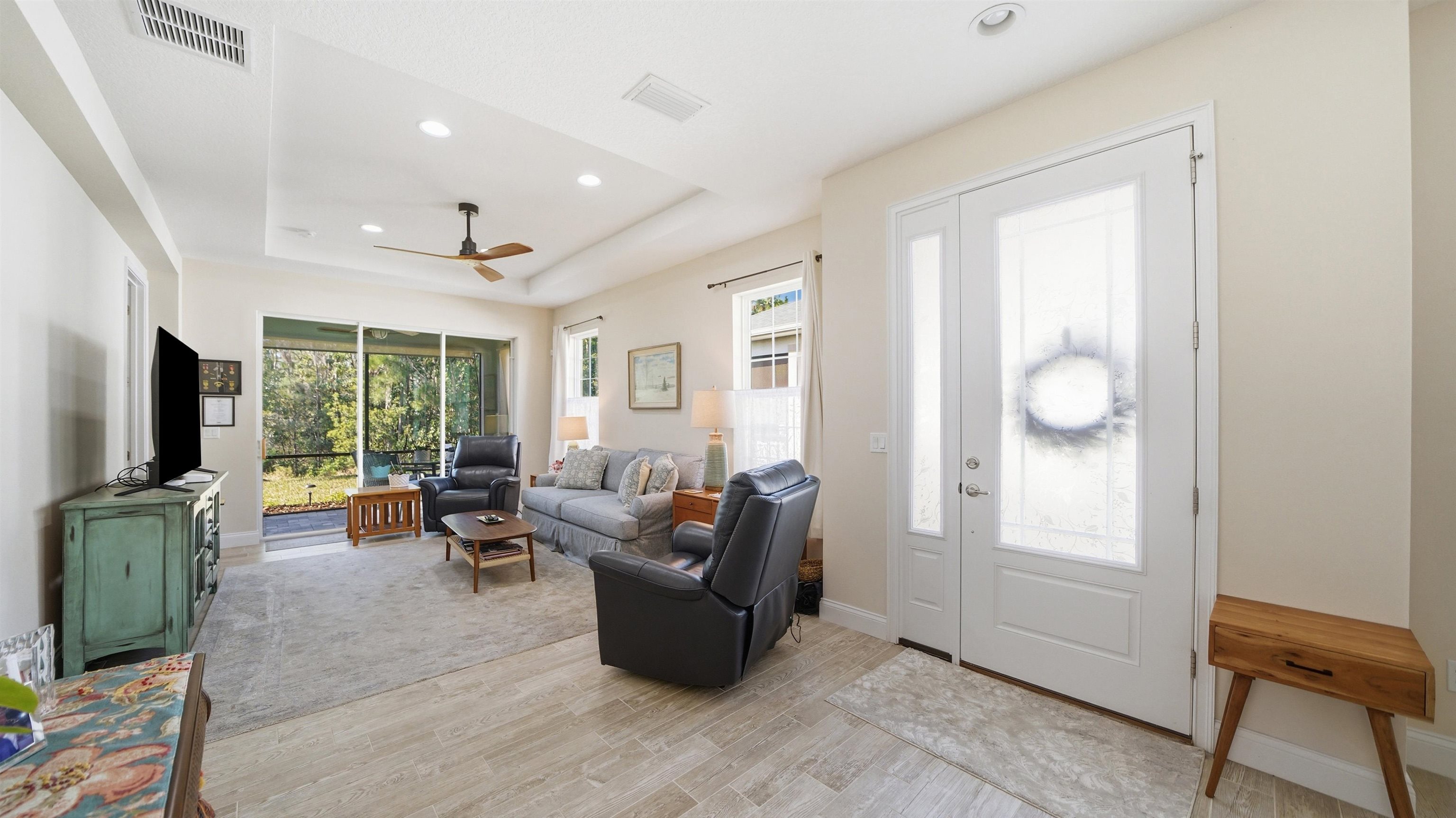 74 Wrendale Loop Ormond Beach, FL 32174 - Photo 15 of 59 a living room with furniture and a flat screen tv