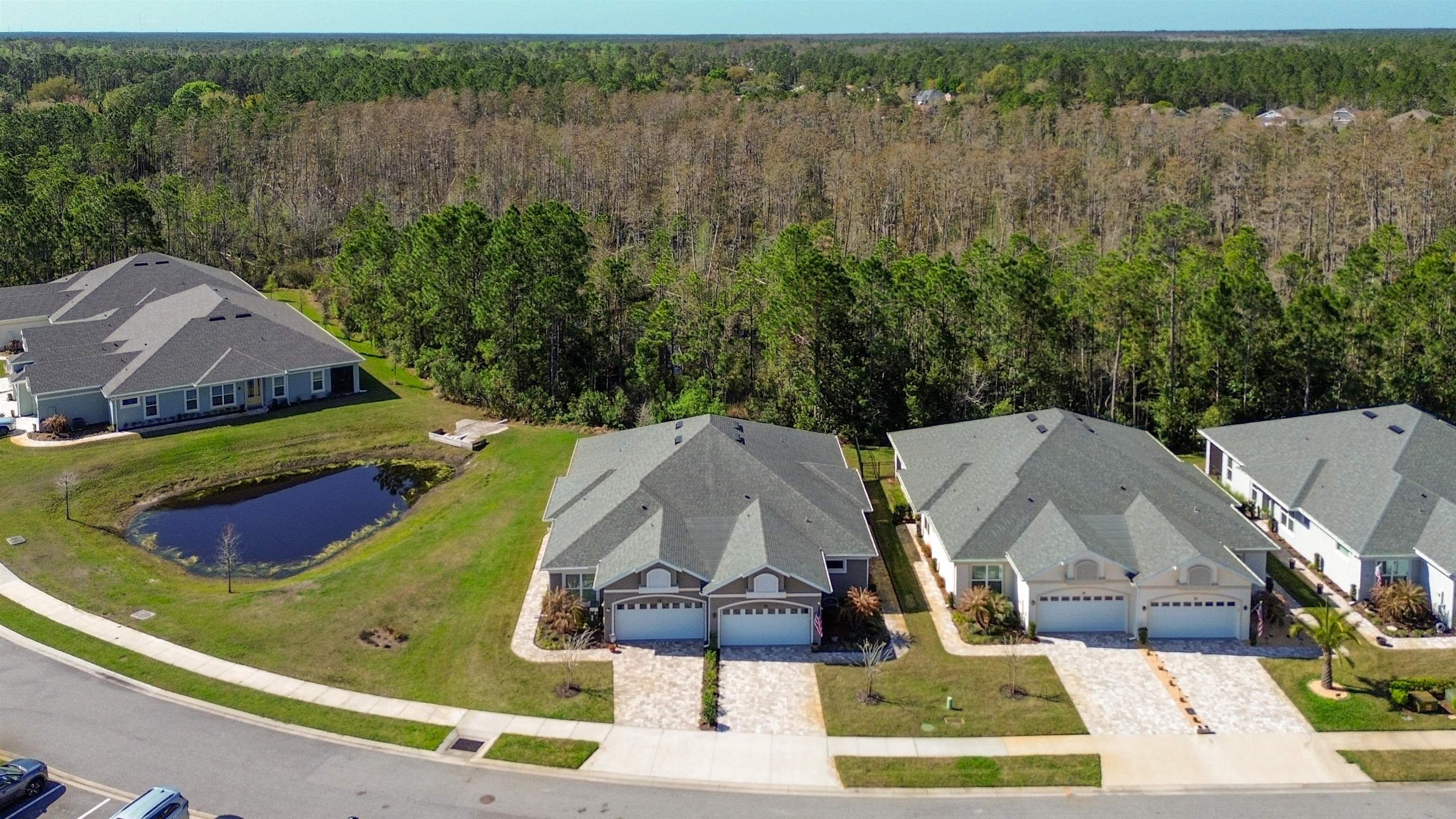 74 Wrendale Loop Ormond Beach, FL 32174 - Photo 47 of 59 an aerial view of a house with swimming pool and lake view