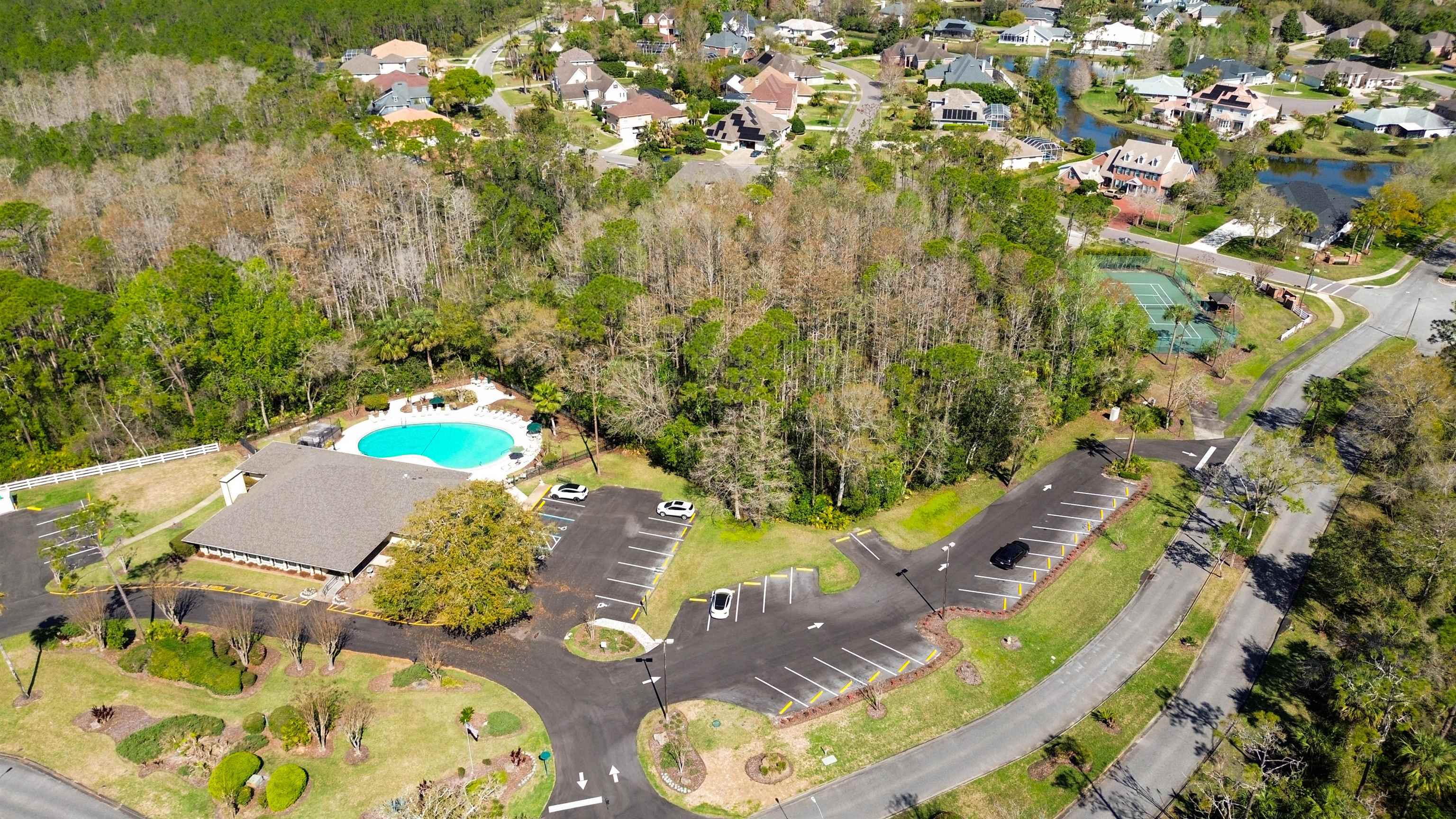 74 Wrendale Loop Ormond Beach, FL 32174 - Photo 54 of 59 an aerial view of a house with swimming pool and large trees