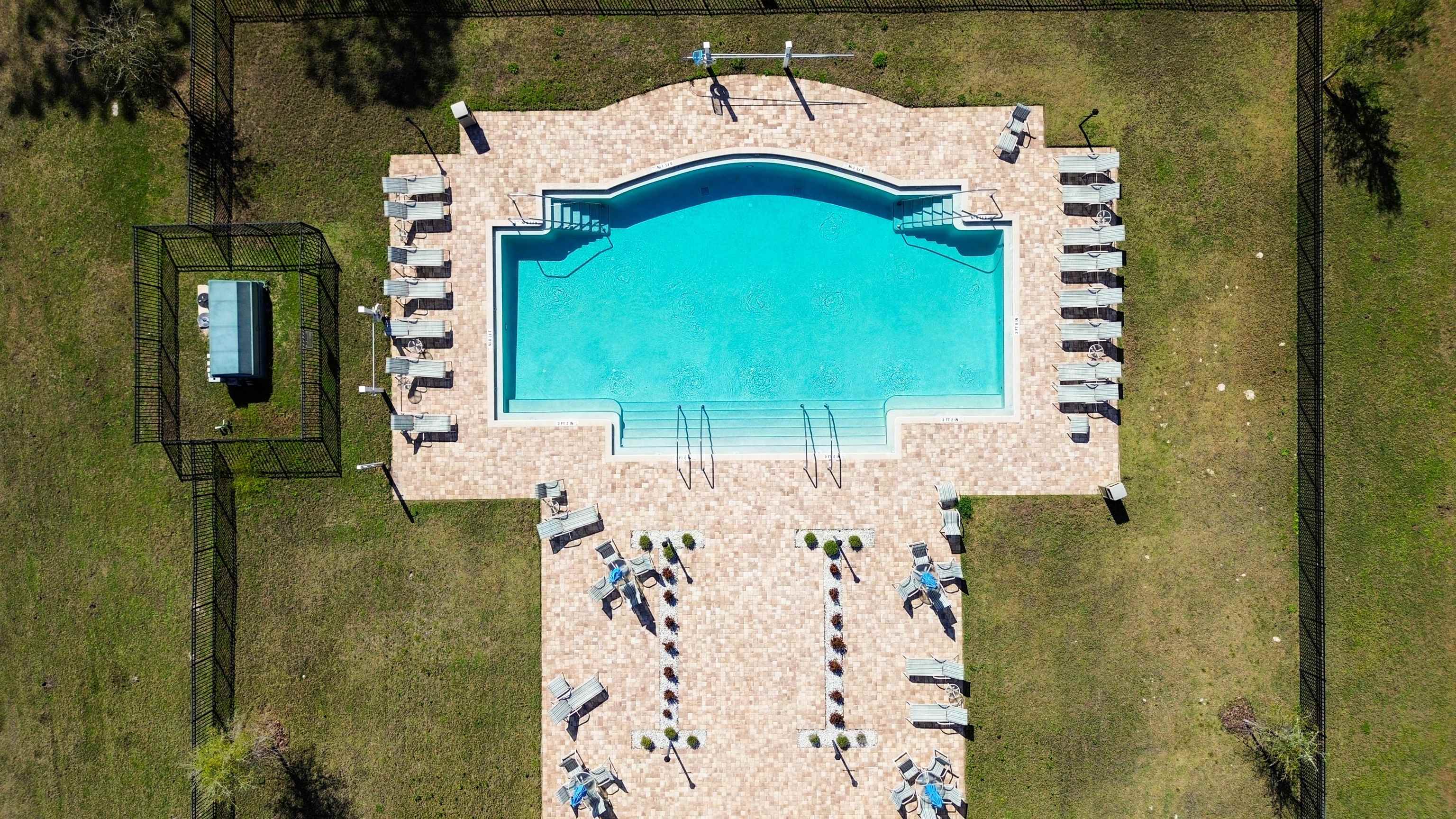 74 Wrendale Loop Ormond Beach, FL 32174 - Photo 6 of 59 Drone / aerial view of a pool area