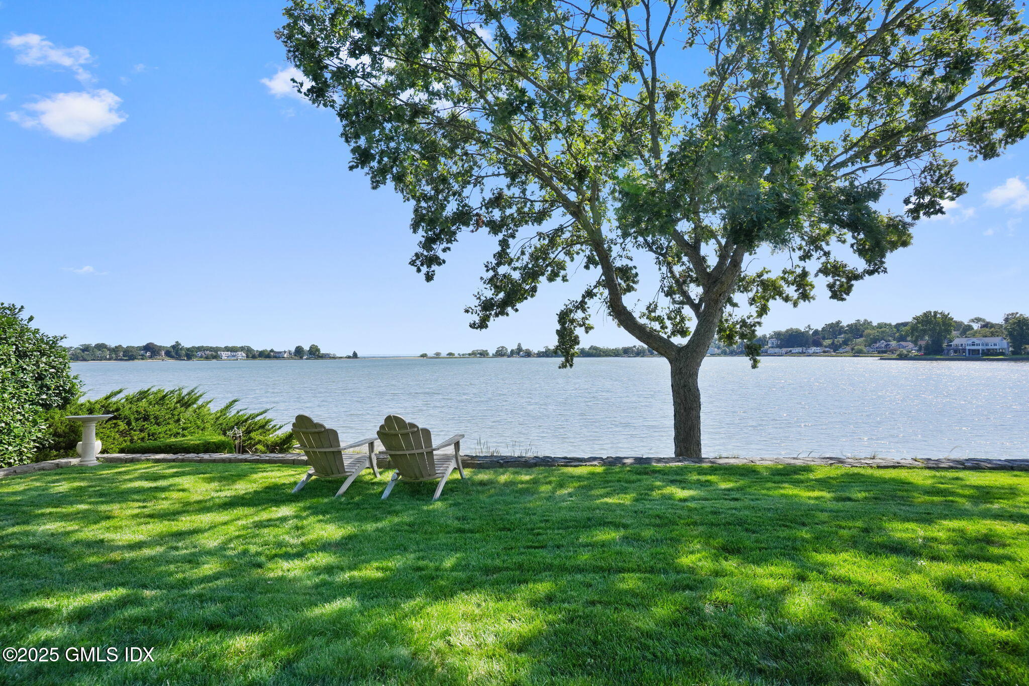 19 Weeds Landing Darien, CT 06820 - Photo 11 of 98 a view of a lake with a yard and large trees