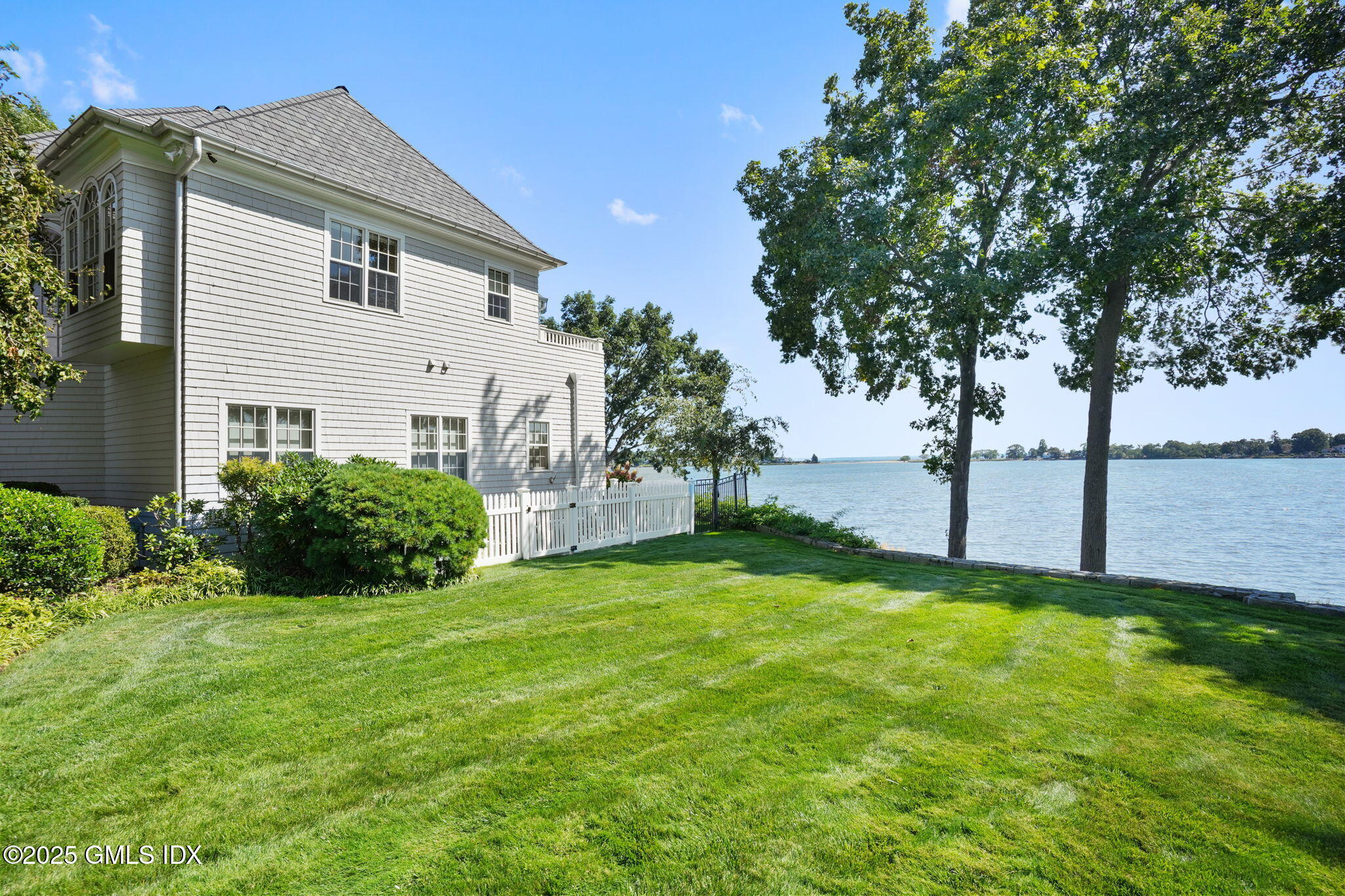 19 Weeds Landing Darien, CT 06820 - Photo 13 of 98 a view of a house with a yard and a large tree