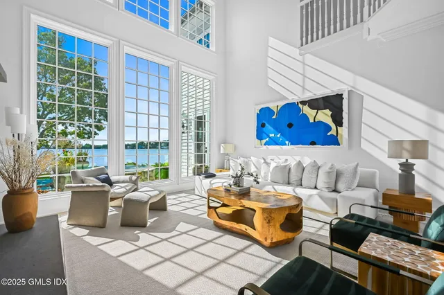 a spacious bathroom with a double vanity sink mirror and bathtub