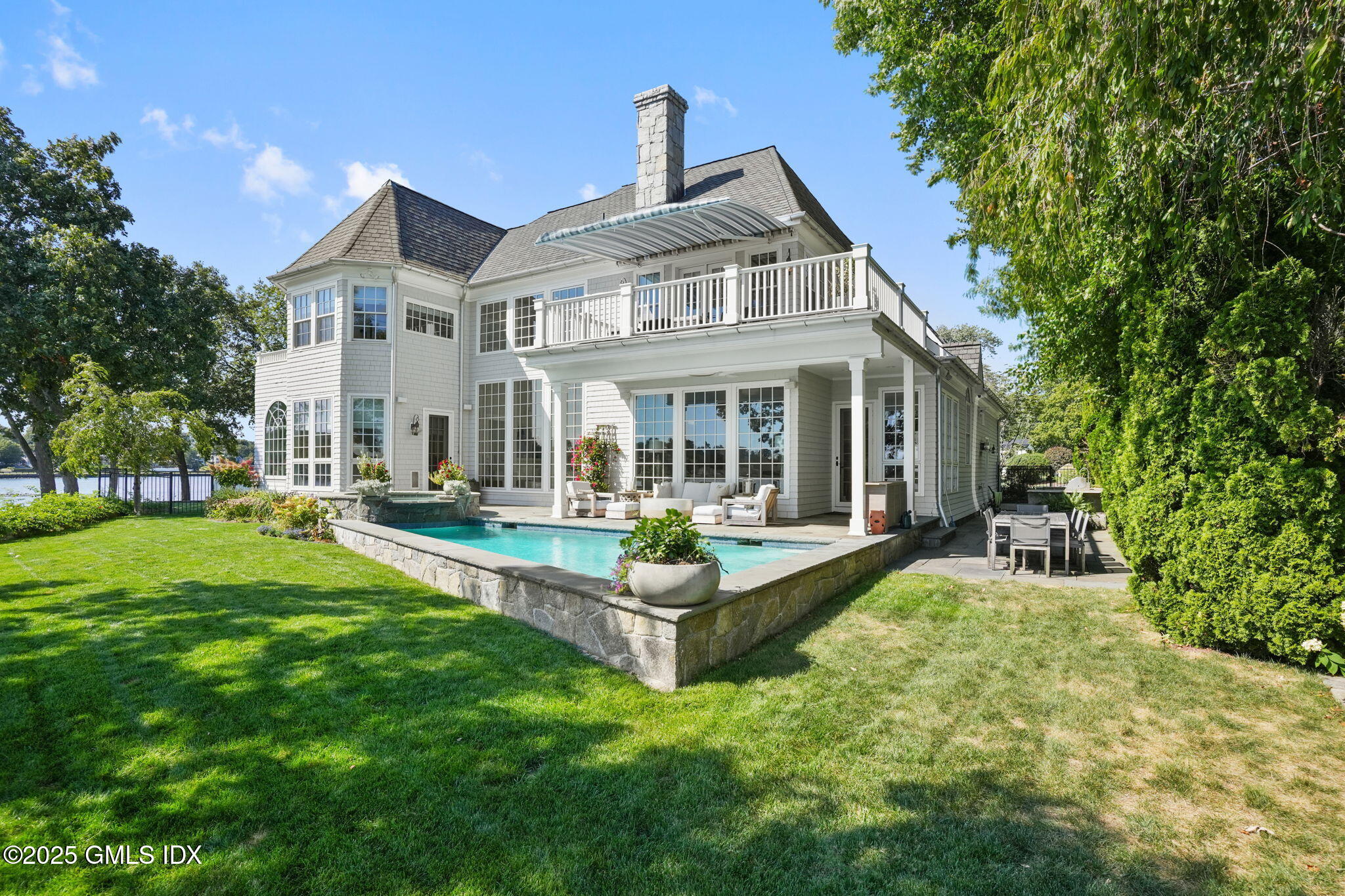 19 Weeds Landing Darien, CT 06820 - Photo 2 of 98 a view of a house with a yard and sitting area