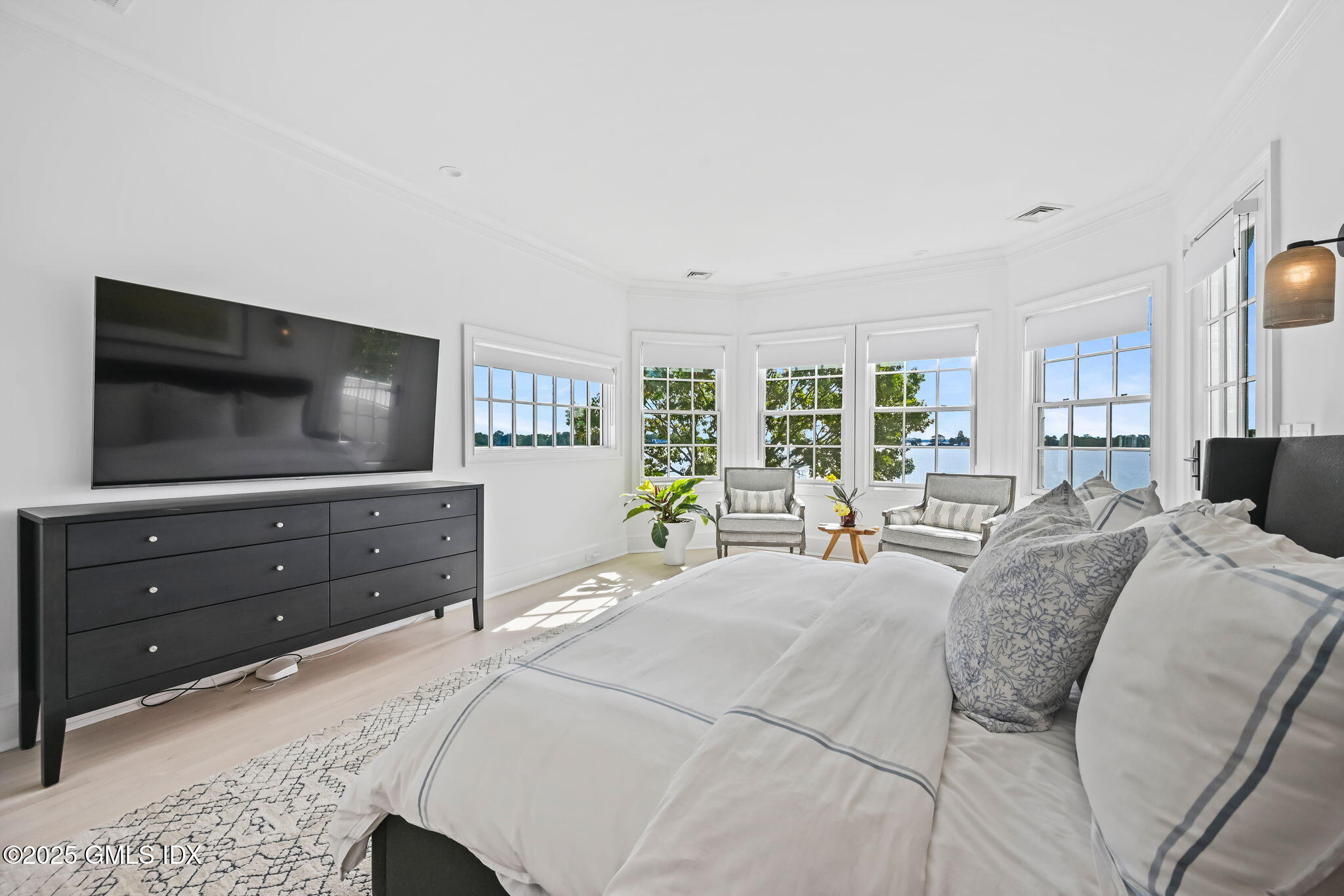 19 Weeds Landing Darien, CT 06820 - Photo 29 of 98 a bedroom with a bed and a flat screen tv