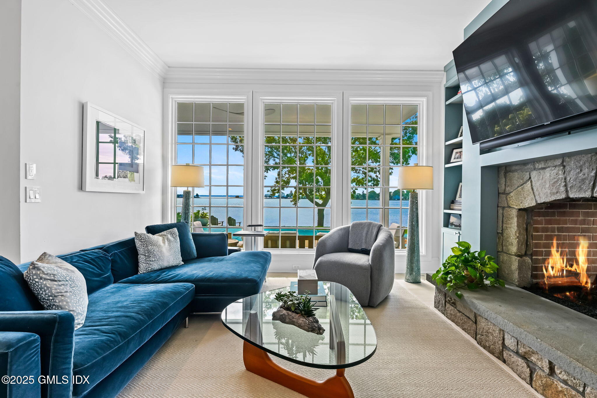 19 Weeds Landing Darien, CT 06820 - Photo 38 of 98 a living room with furniture and a fireplace
