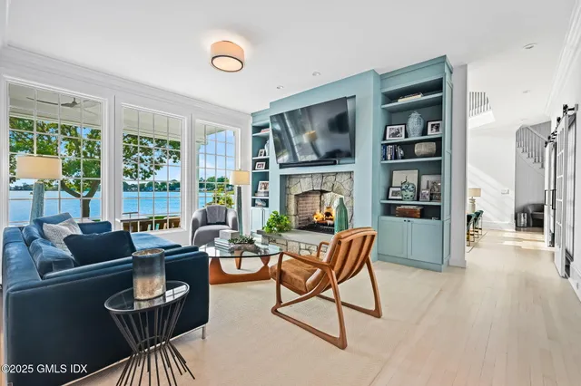 a view of swimming pool with outdoor seating and a garden