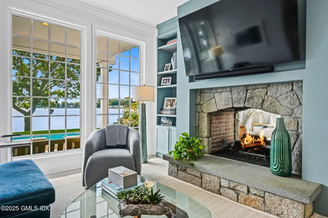 a front view of a house with a yard table and chairs