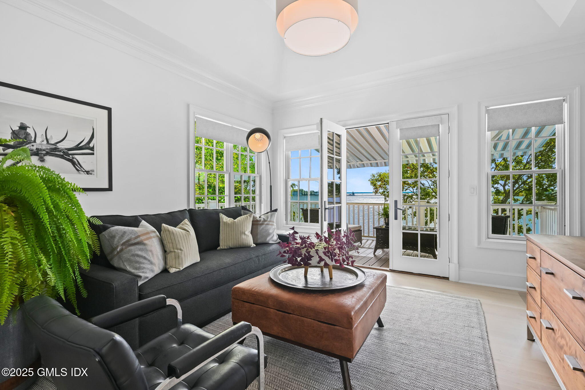 19 Weeds Landing Darien, CT 06820 - Photo 48 of 98 a living room with furniture and a large window