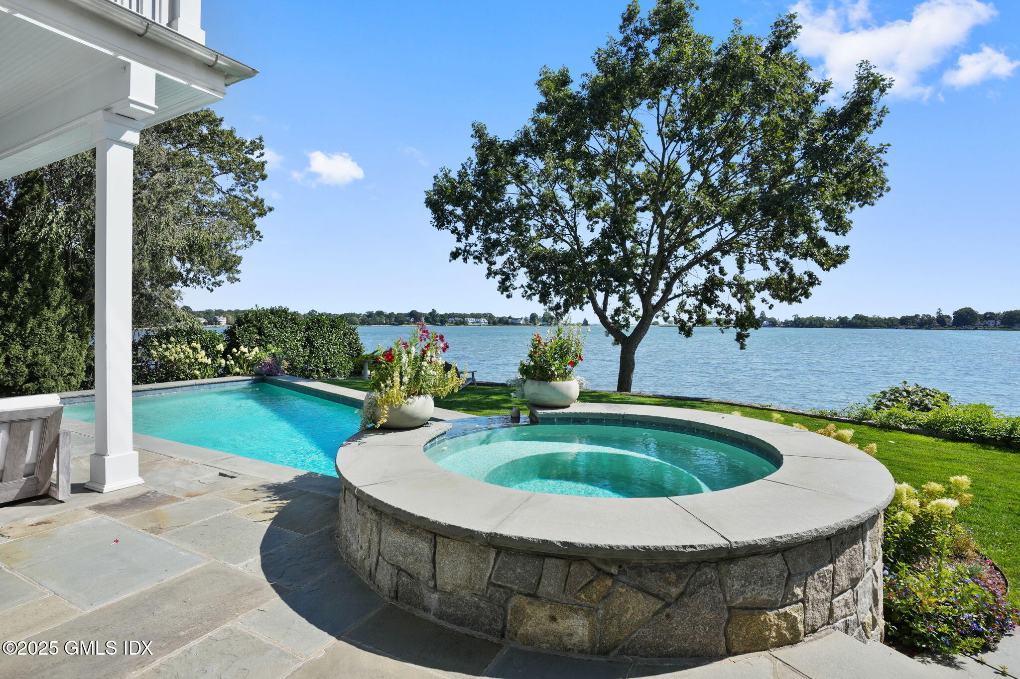 19 Weeds Landing Darien, CT 06820 - Photo 5 of 98 a view of a swimming pool with a patio