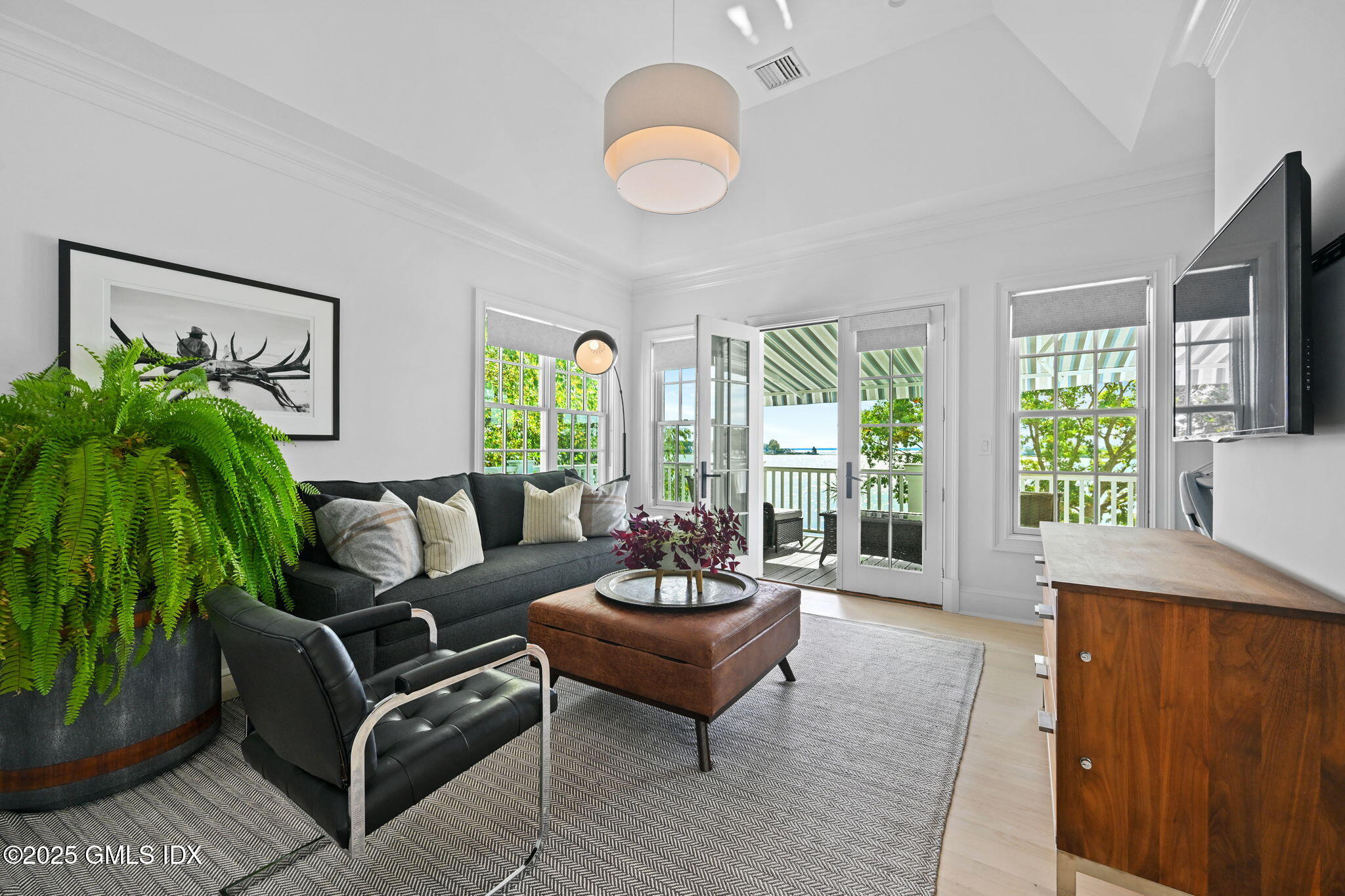 19 Weeds Landing Darien, CT 06820 - Photo 52 of 98 a living room with furniture and a large window