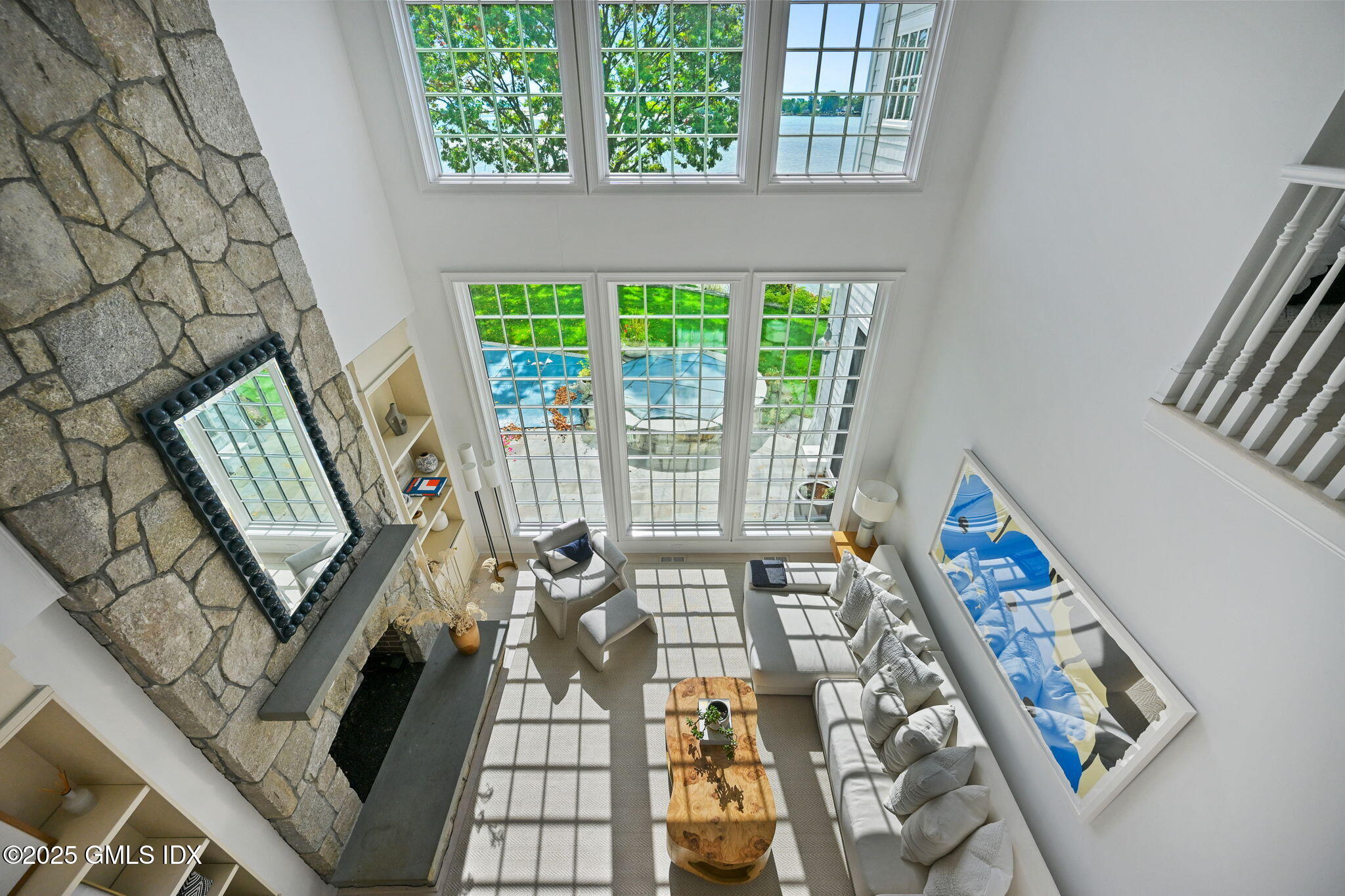 19 Weeds Landing Darien, CT 06820 - Photo 62 of 98 a living room with furniture and a floor to ceiling window