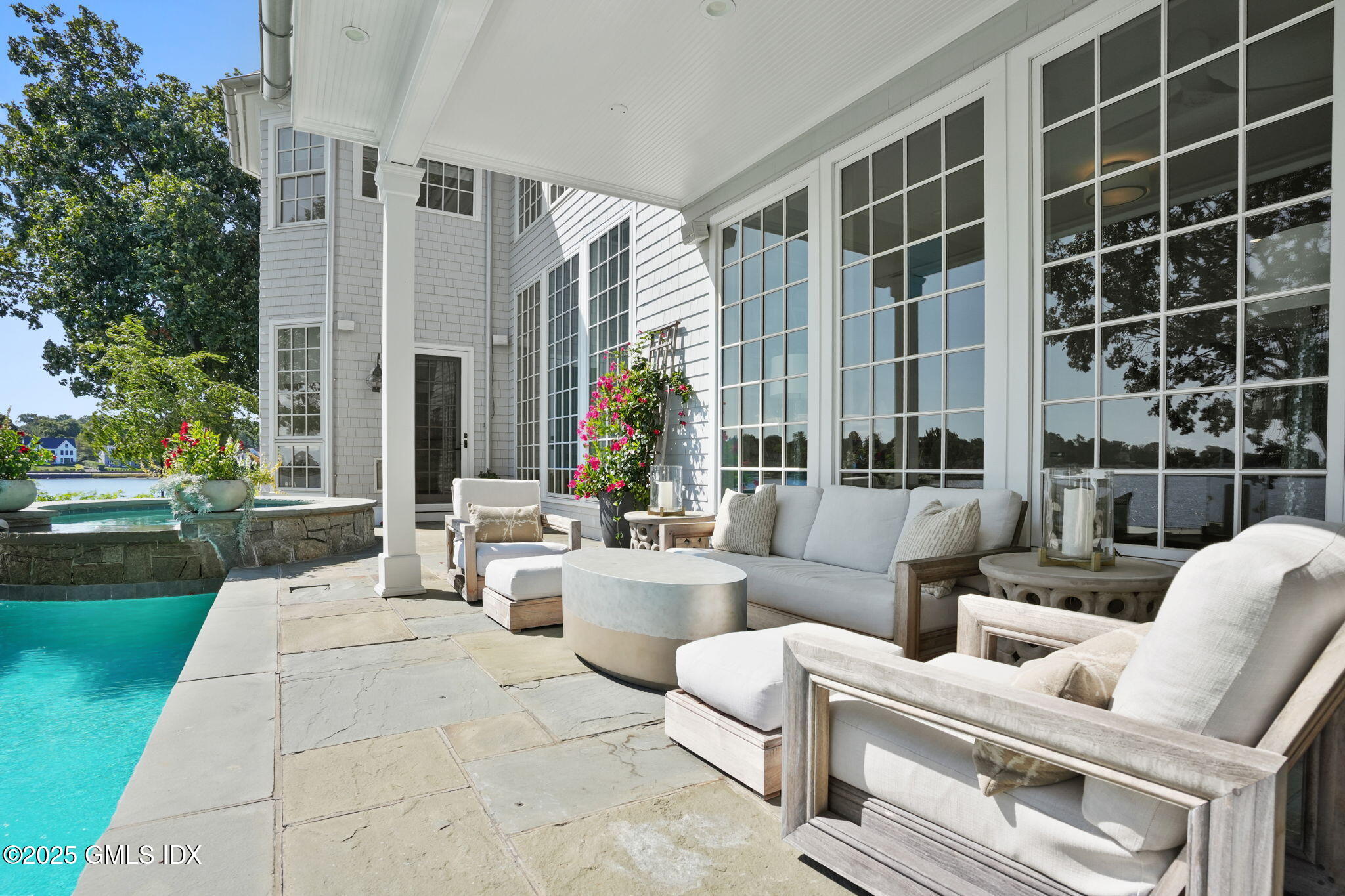 19 Weeds Landing Darien, CT 06820 - Photo 66 of 98 a building outdoor space with patio furniture and garden