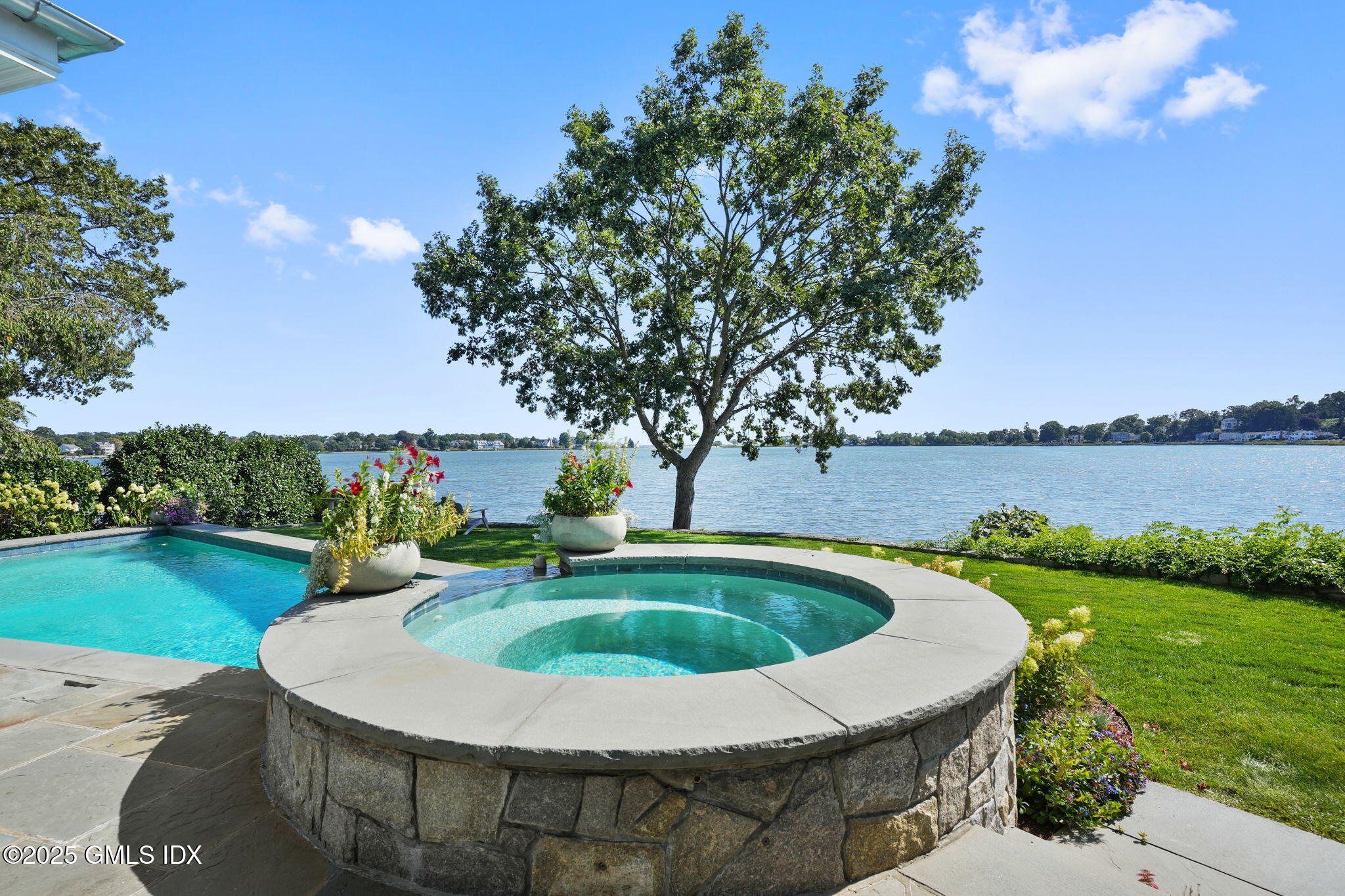 19 Weeds Landing Darien, CT 06820 - Photo 67 of 98 a view of a swimming pool with a yard