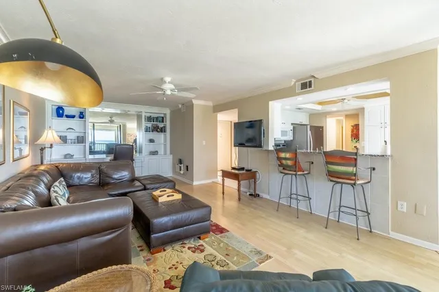 a living room with furniture and a painting