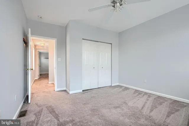 a bathroom with a toilet and shower