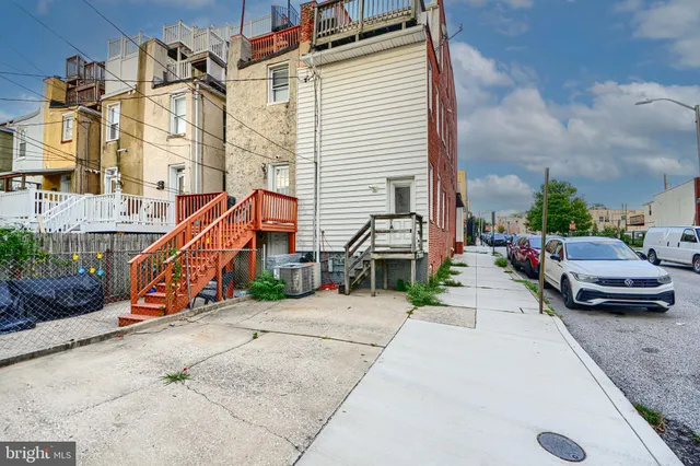 a city street lined with buildings and a street
