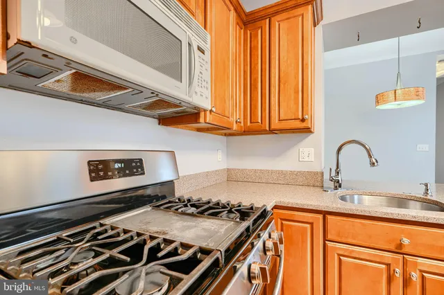 a kitchen with a stove and a sink