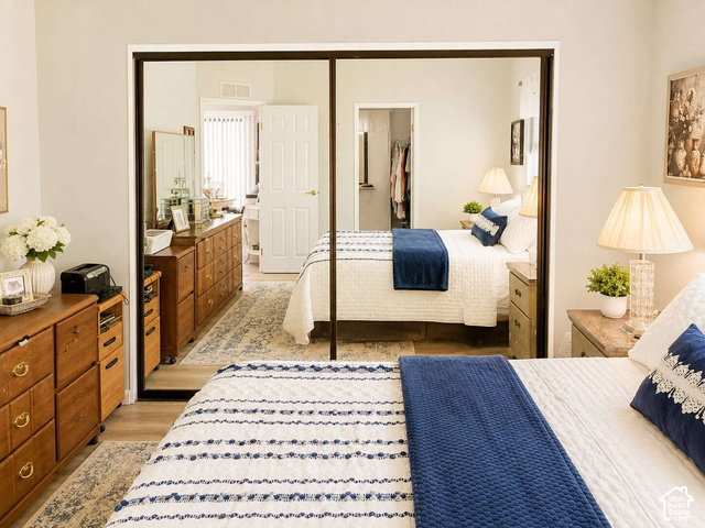1526 North Dixie Downs Road, Unit 29 St. George, UT 84770 - Photo 8 of 16 Mirrored sliding closet doors and light wood-finish flooring